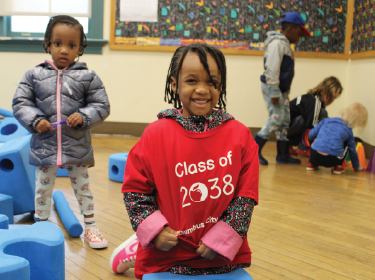 girl smiling in a shirt that reads class of 2038